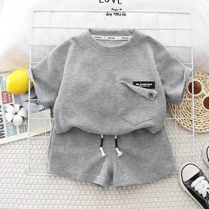 Ensemble deux pièces d'été décontracté pour enfants, T-shirt à manches courtes en coton de couleur unie et short