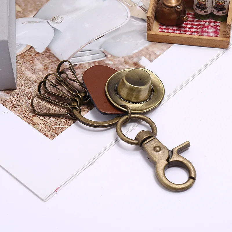 Porte-clés chapeau de cowboy rétro, pendentif porte-clés de voiture en cuir de vachette en métal bronze, souvenir des cowboys occidentaux jeunesse