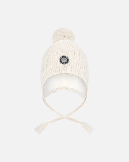 Bonnet d'hiver doublé avec pompon blanc cassé