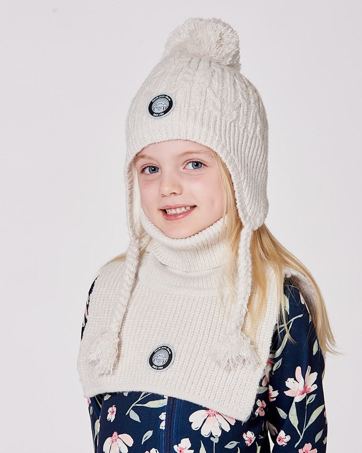 Bonnet d'hiver doublé avec pompon blanc cassé
