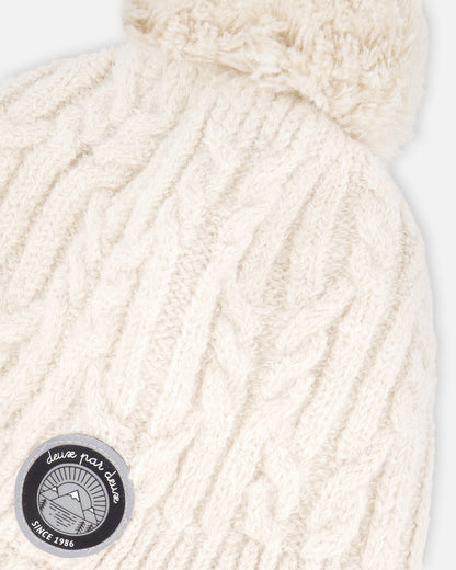 Bonnet d'hiver doublé avec pompon blanc cassé