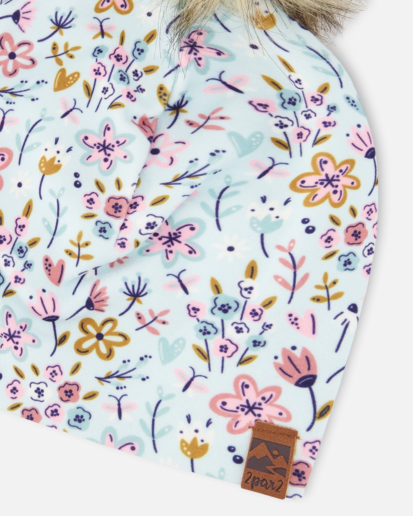 Bonnet en jersey extensible bleu à mini imprimé fleuri avec pompon