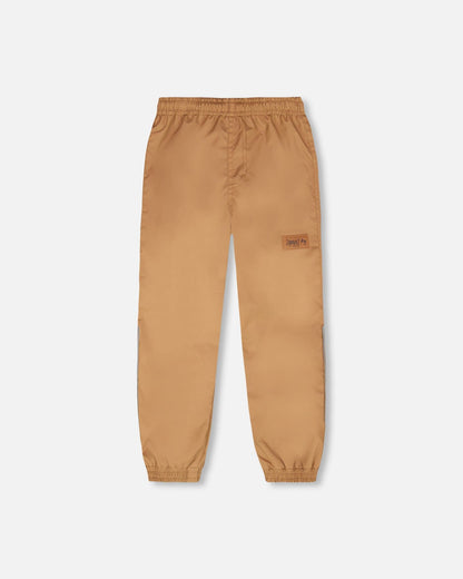 Pantalon de pluie en polyester recyclé brun clair