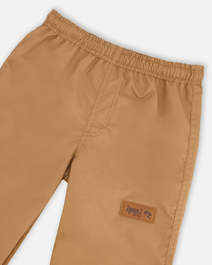 Pantalon de pluie en polyester recyclé brun clair