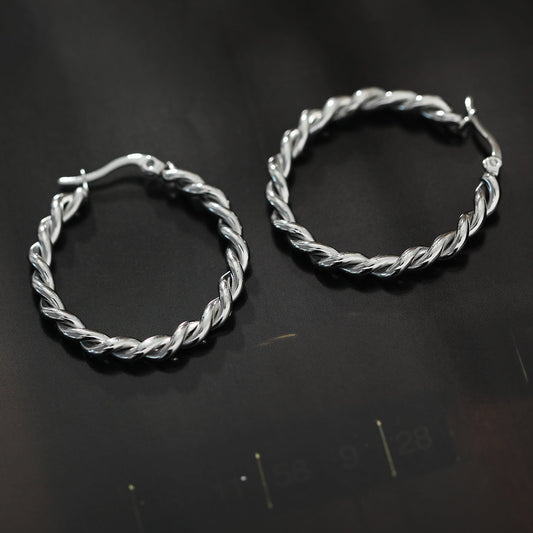 Boucles d'oreilles créoles torsadées SUKI en argent