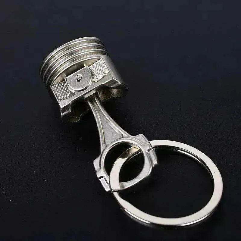 Porte-clés en métal en forme de piston