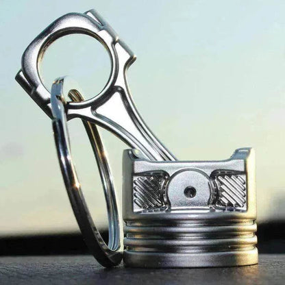 Porte-clés en métal en forme de piston