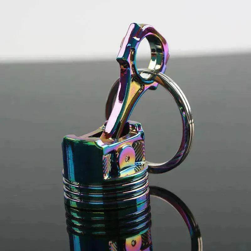 Porte-clés en métal en forme de piston