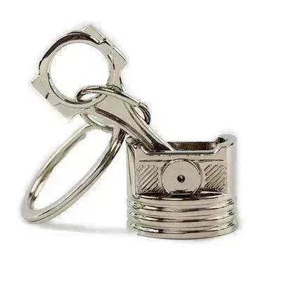 Porte-clés en métal en forme de piston