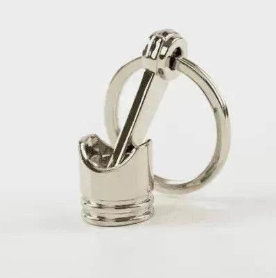 Porte-clés en métal en forme de piston