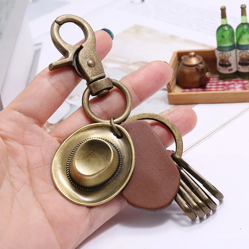 Porte-clés chapeau de cowboy rétro, pendentif porte-clés de voiture en cuir de vachette en métal bronze, souvenir des cowboys occidentaux jeunesse