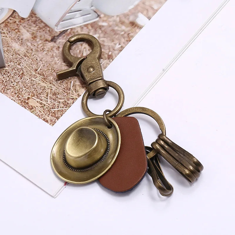Porte-clés chapeau de cowboy rétro, pendentif porte-clés de voiture en cuir de vachette en métal bronze, souvenir des cowboys occidentaux jeunesse