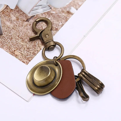 Porte-clés chapeau de cowboy rétro, pendentif porte-clés de voiture en cuir de vachette en métal bronze, souvenir des cowboys occidentaux jeunesse