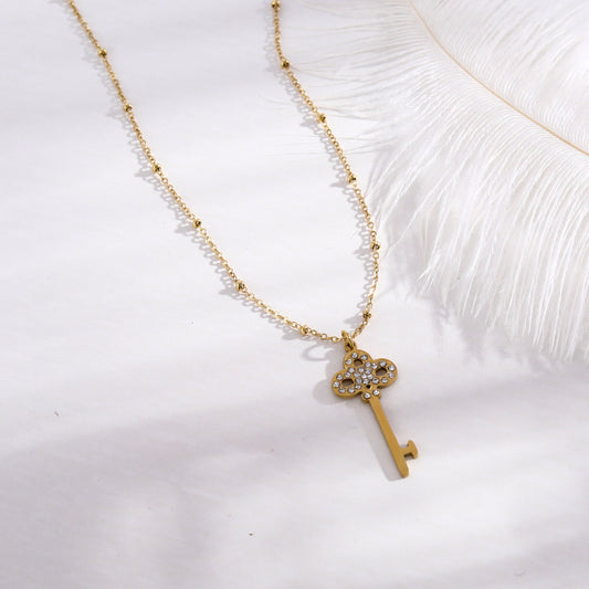 UNLOK Collier à chaîne perlée en or avec pendentif clé orné de zircone