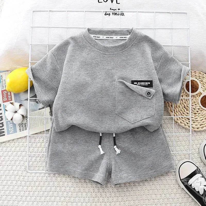 Ensemble deux pièces d'été décontracté pour enfants, T-shirt à manches courtes en coton de couleur unie et short